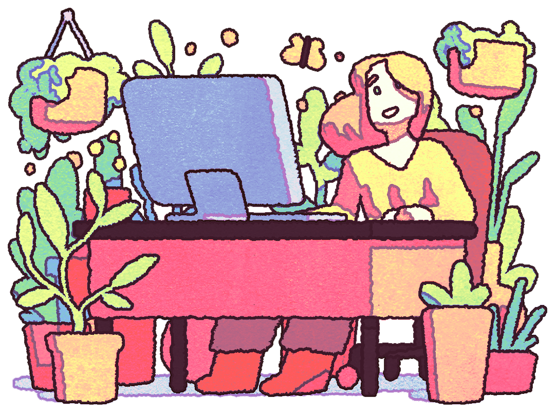 person at desk with luscious greenery